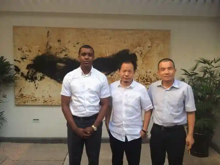 Ony Ghonda Mangalibi with Zendai Group founder Dai Zhikang and a senior Zendai executive in 2014